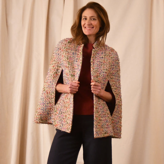 A Vintage Style Swing Cape  in Pale Multicoloured Boucle from Linton Tweeds. Fun, young and elegant. Handmade in Britain. 