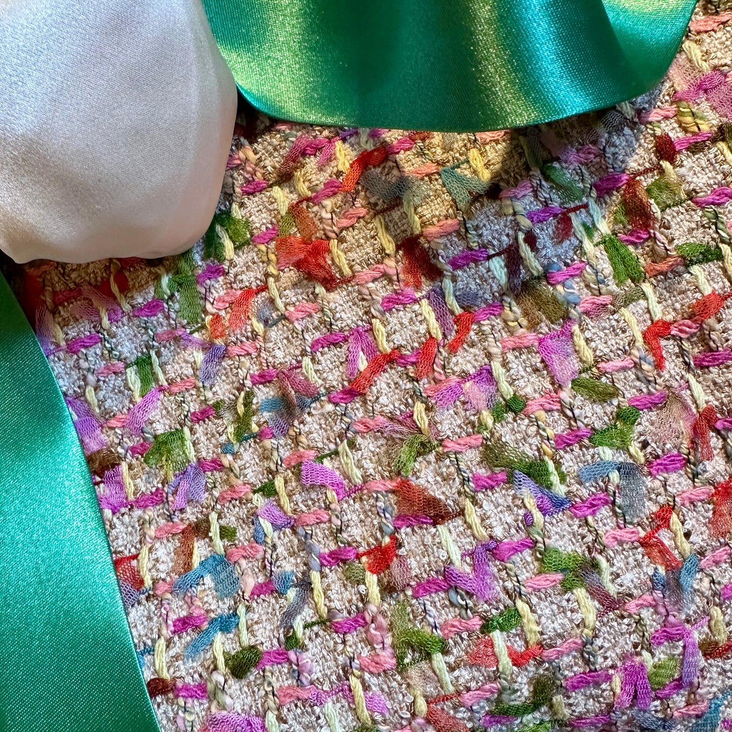 Rear View of A Vintage Style Swing Cape  in Pale Multicoloured Boucle from Linton Tweeds. Fun, young and elegant. Handmade in Britain.  Fabric Close Up.