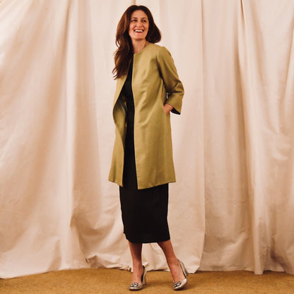 Bespoke Trapeze Coat in Silk Matka. This is a Summer Weight Silk Car Coat style shorter length coat which is available to order in a host of colours. Handmade in Great Britain. Hands in Pocket view.