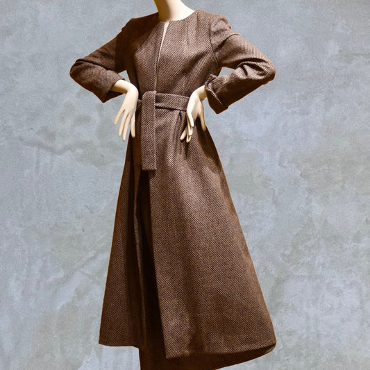 Fitted and tailored hourglass coat in Pink Patterned Tweed over a matching long skirt. Handmade in Britain. Shown Belted.