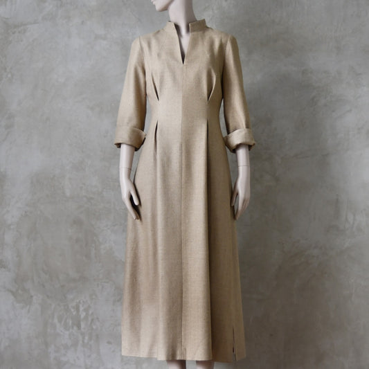 Cream coloured Waisted longer length  formal mid-season tailored dress. Ready to Ship and Made to order. Sizes 6 to 20 and bespoke. Made by hand in East London.