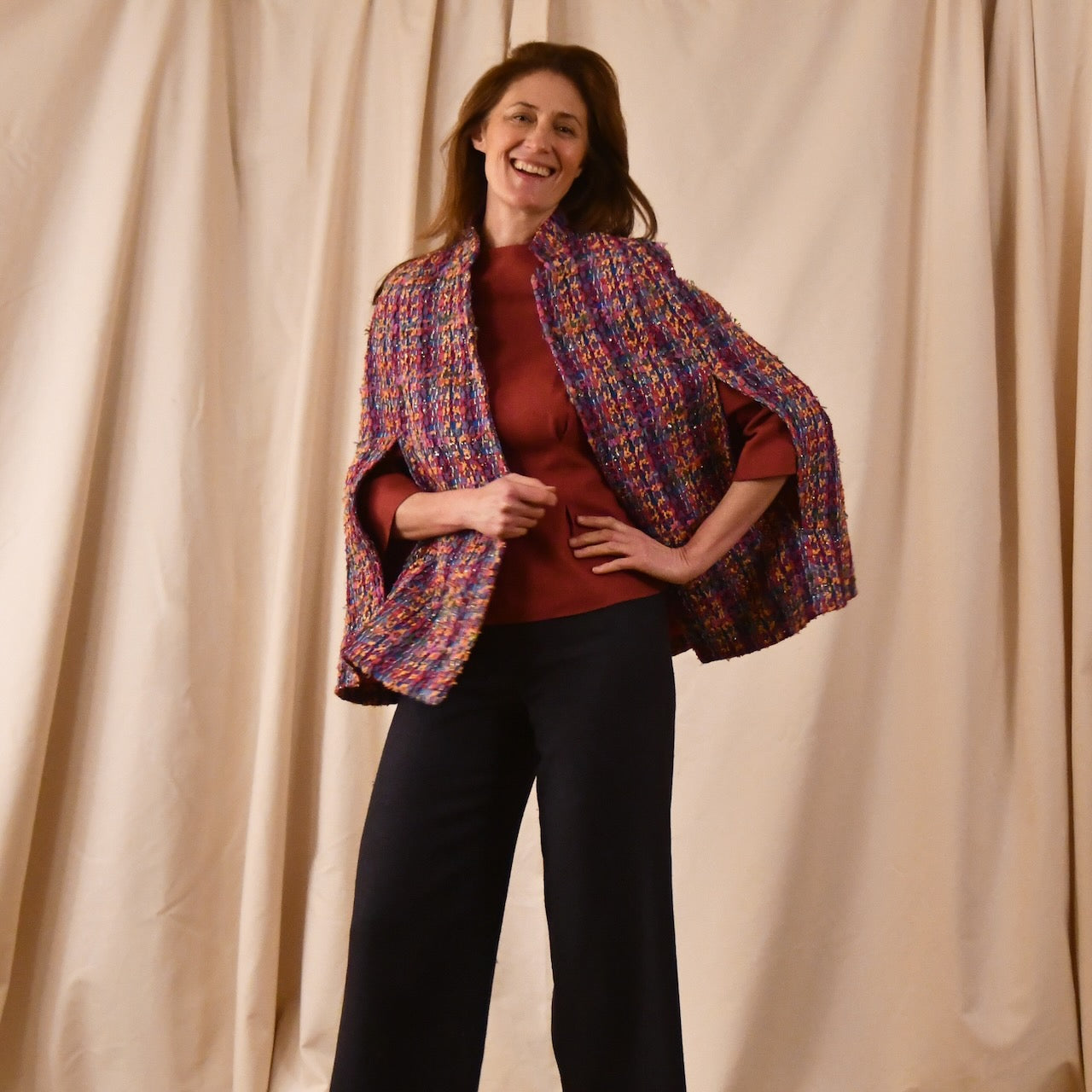 A Vintage Style Swing Cape in Raspberry Boucle from Linton Tweeds. Fun, young and elegant. Handmade in Britain. 