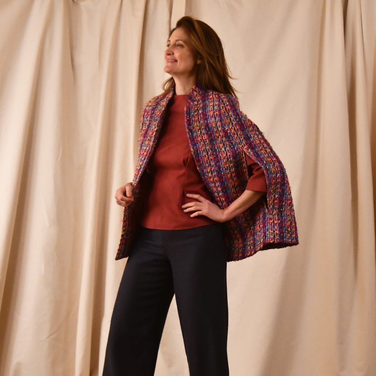 A Vintage Style Swing Cape in Raspberry Boucle from Linton Tweeds. Fun, young and elegant. Handmade in Britain.  Open View.
