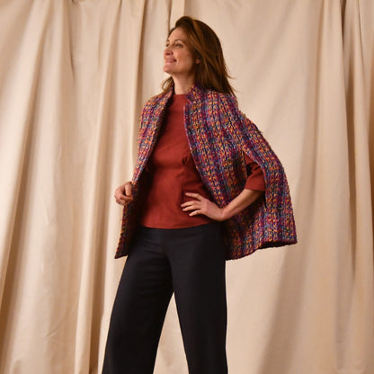 A Vintage Style Swing Cape in Raspberry Boucle from Linton Tweeds. Fun, young and elegant. Handmade in Britain.  Open View.