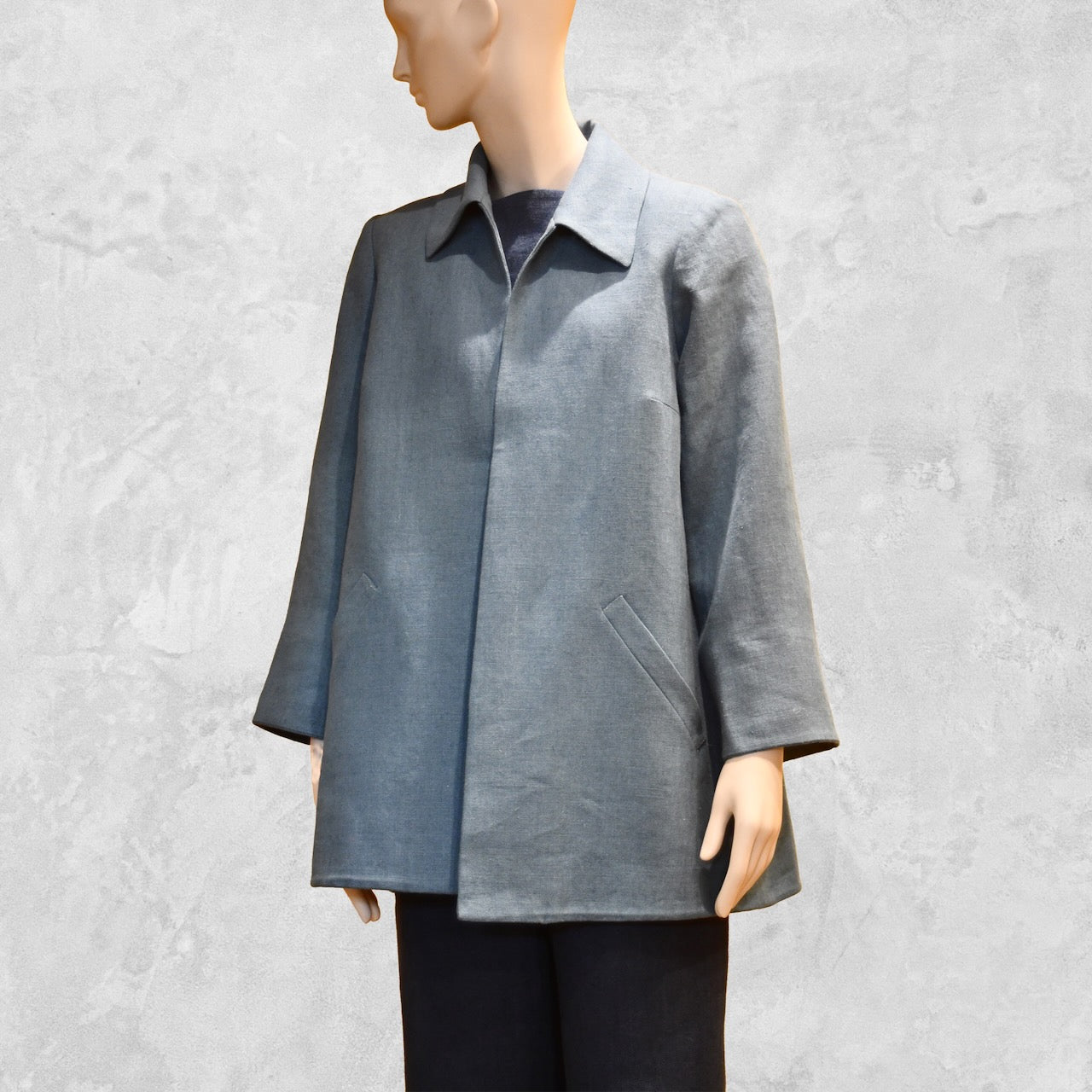 Light Blue Swing Jacket in Irish Linen. Easy and elegant jacket with cuff detail, slant pockets and a wide neck. Handmade in Britain. Close Up View.