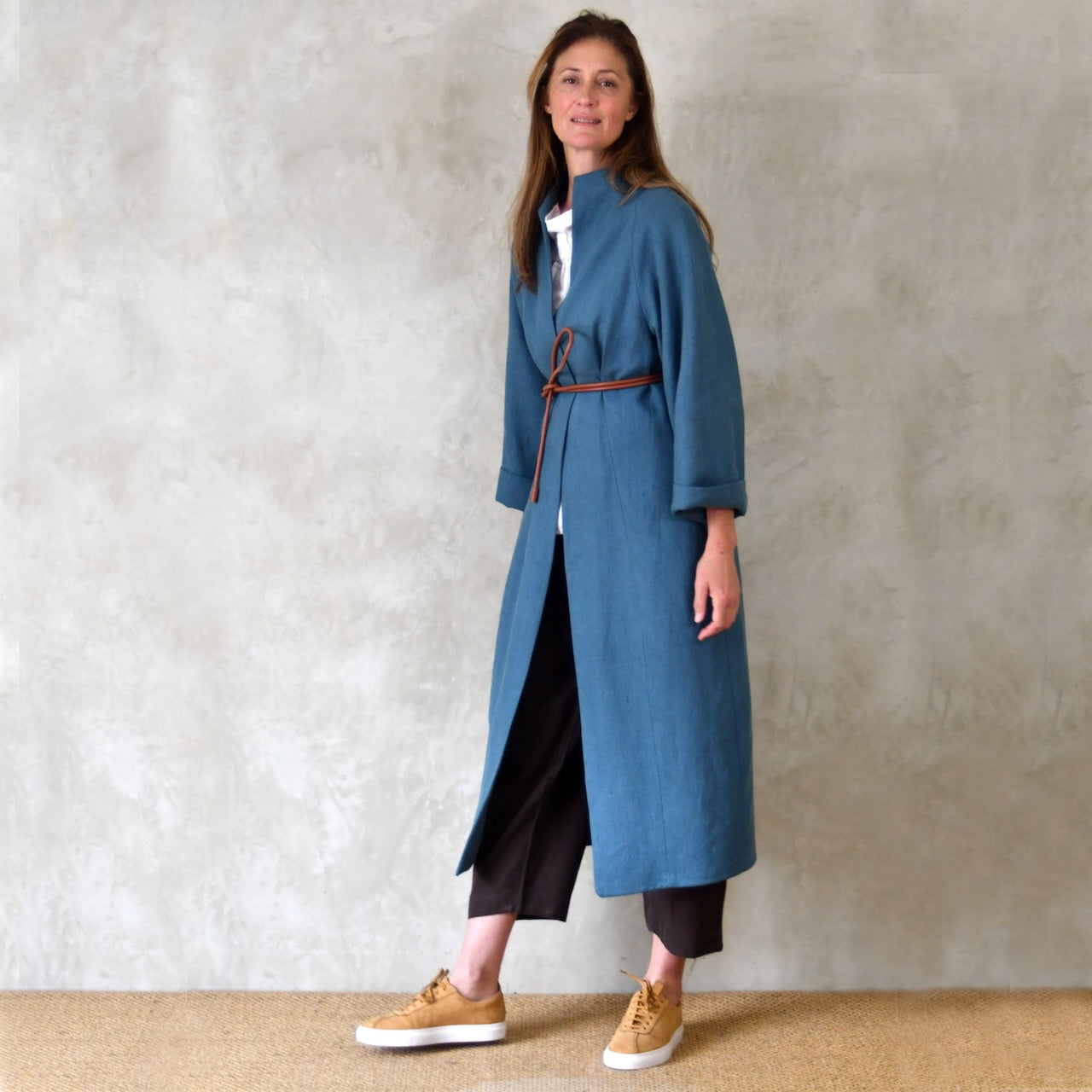 Longer Length Cocoon Coat in Blue Irish Linen. An easy to wear Spring-summer coat in a delightfully flattering cocoon shape. An investment piece to last across the years. Handmade in Britain.