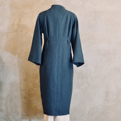 Longer Length Cocoon Coat in Blue Irish Linen. An easy to wear Spring-summer coat in a delightfully flattering cocoon shape. An investment piece to last across the years. Handmade in Britain. Back View.