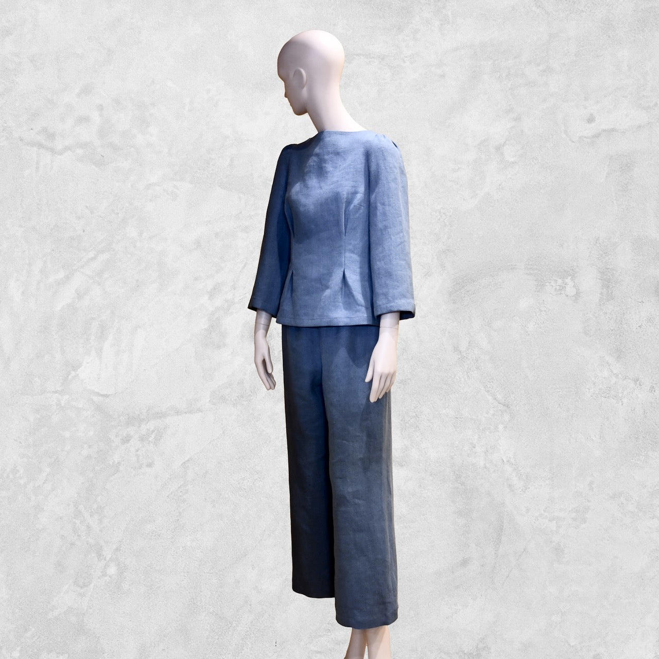 Bespoke Sea Blue Boat Neck Tailored Top  with three quarter sleeves in Slubby Irish Linen. Shown worn over matching seafoam linen trousers, full view.
Handmade in Britain.