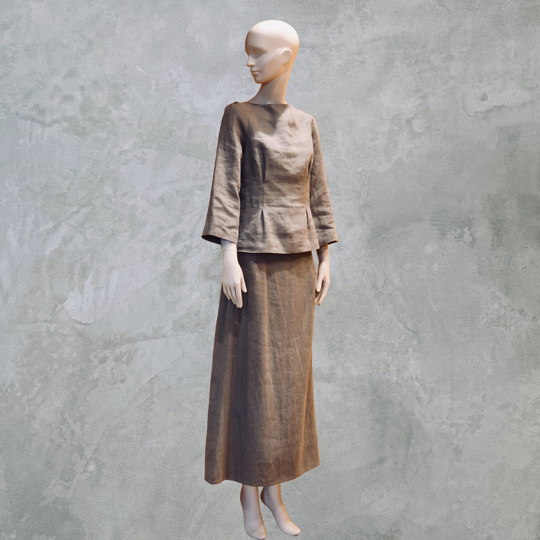A Tailored Boat Neck Skirt Suit in Brown Midweight Irish Linen, featuring an a-line skirt and boat neck blouse. Made by Hand in Great Britain. 