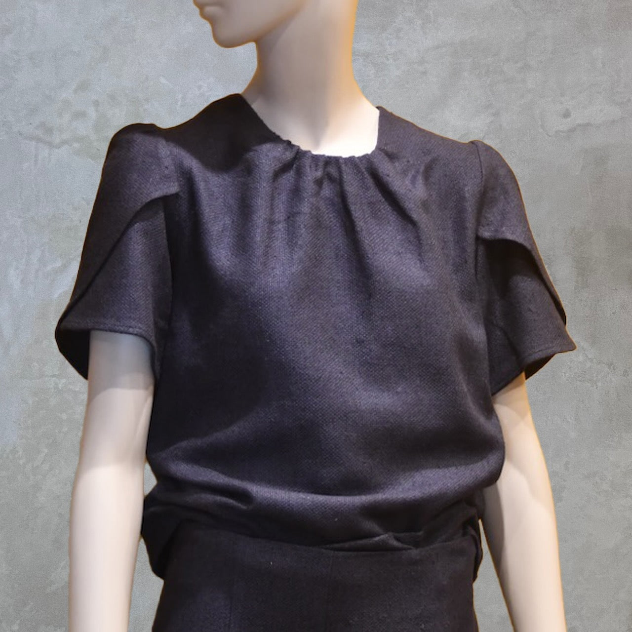 A Tulip Sleeve Blouse in Inky Blue Silk Matka Weave, featuring a gathered neckline. Handmade in Britain.
