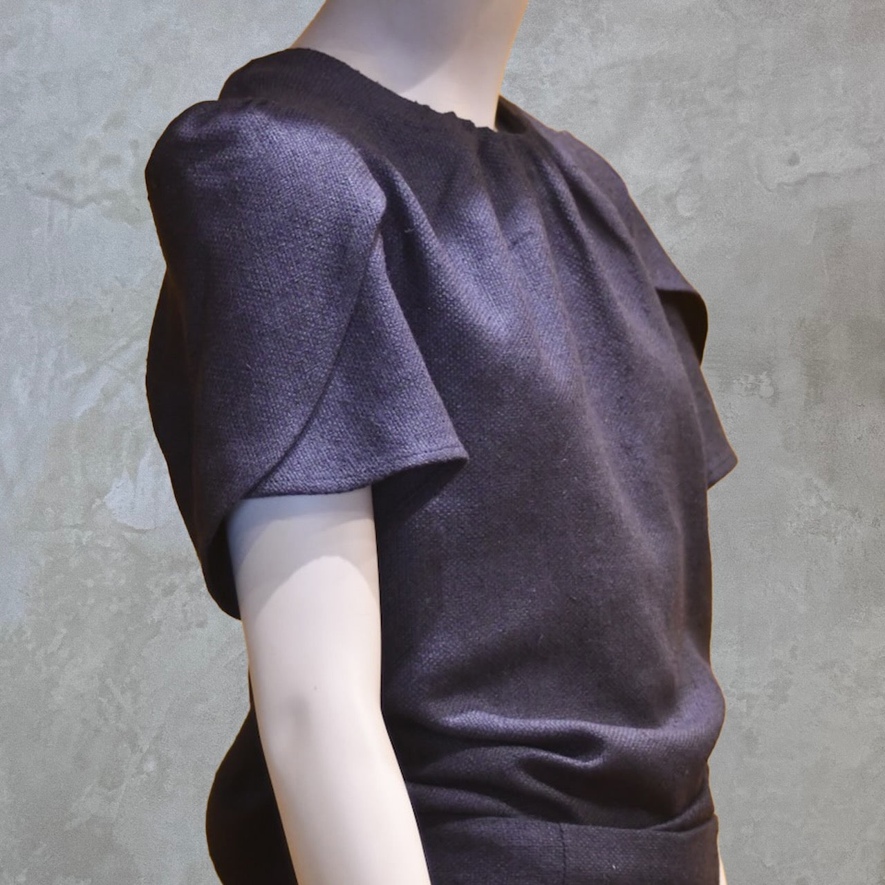 A Tulip Sleeve Blouse in Inky Blue Silk Matka Weave, featuring soft folds and a round neckline. Handmade in Britain.