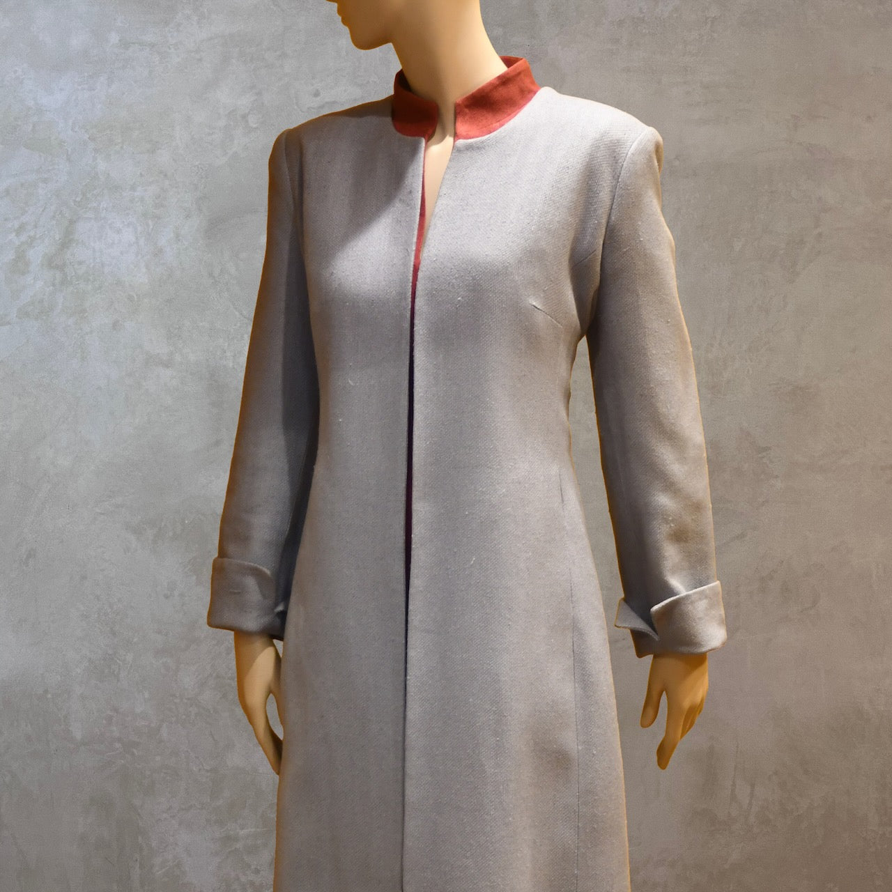 Side Close up view showing waist and bust details on Fitted Coat with nipped in waist executed in a delightful pure silk silk matka weave. Handmade in London this longer length coat is perfect for weddings and formal summer occasions.