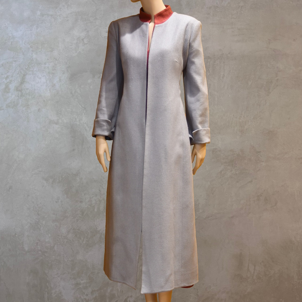 Front view of Fitted Coat with nipped in waist executed in a delightful pure silk silk matka weave. Handmade in London this longer length coat is perfect for weddings and formal summer occasions.