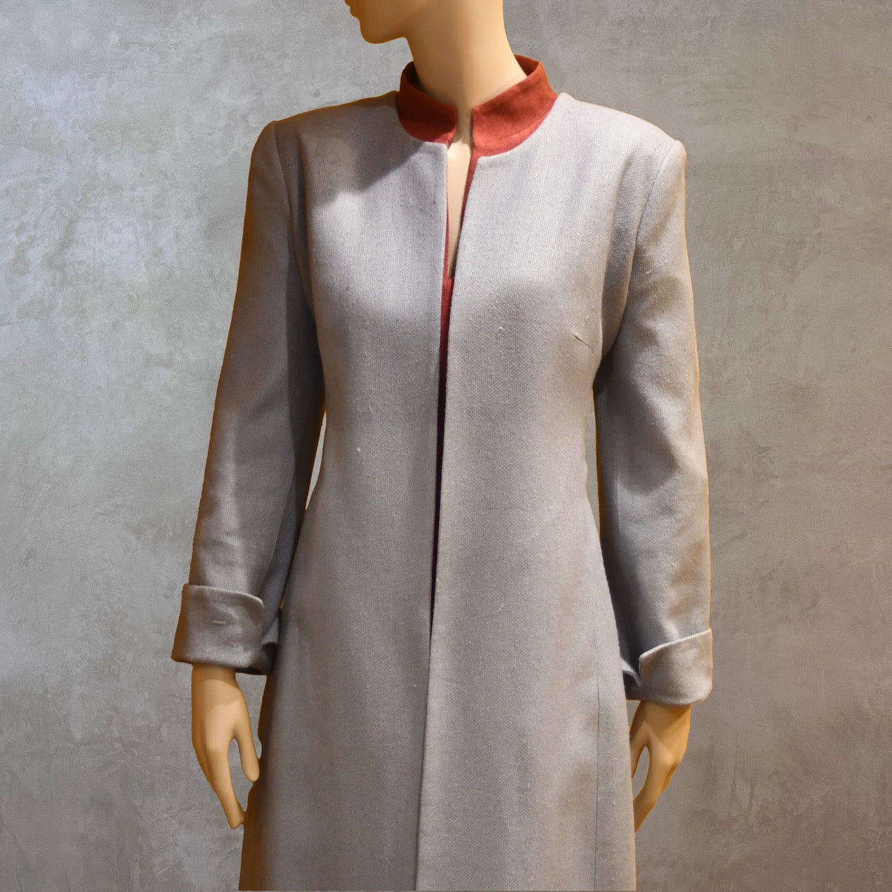 Close up view of Fitted Coat with nipped in waist executed in a delightful pure silk silk matka weave. Handmade in London this longer length coat is perfect for weddings and formal summer occasions.