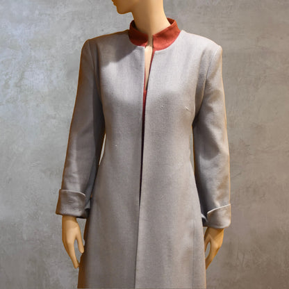 Close up view of Fitted Coat with nipped in waist executed in a delightful pure silk silk matka weave. Handmade in London this longer length coat is perfect for weddings and formal summer occasions.