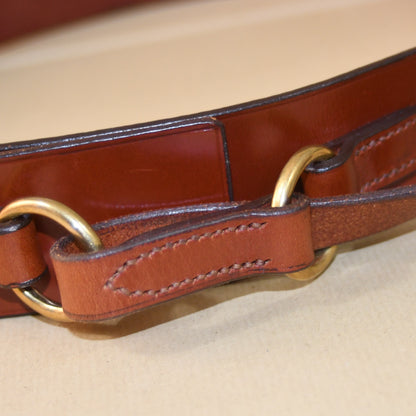 Close-up of the EDNERAT Hazel Ring Wrap Belt - 68cm, crafted from British saddle leather with solid brass fittings and detailed stitching. Handmade in Britain.