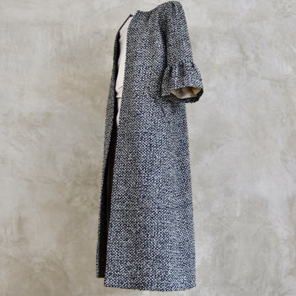 A Longer length Bell Sleeve A-Line Coat in Black and OffWhite Linton Tweeds Boucle
This is an elegant longer length A-Line coat in a patterned boucle from Carlisle. With a magnificent drape and delicate sleeve and shoulder detailing, this coat will take you everywhere. Handmade in Britain.
