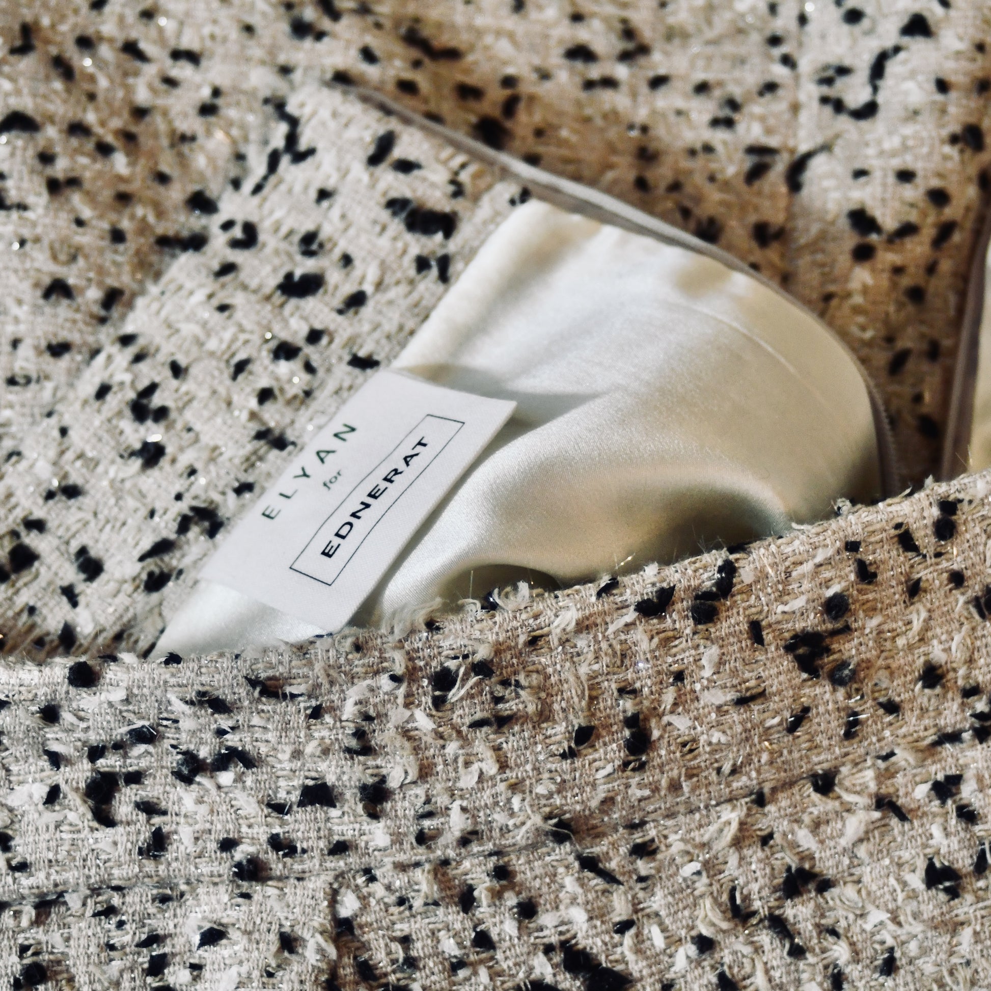 A tailored skirt suit in a light coloured Linton Tweeds bouclé – perfect for Royal Ascot and other formal occasions in spring and summer. Handmade in Britain.  Skirt Lining