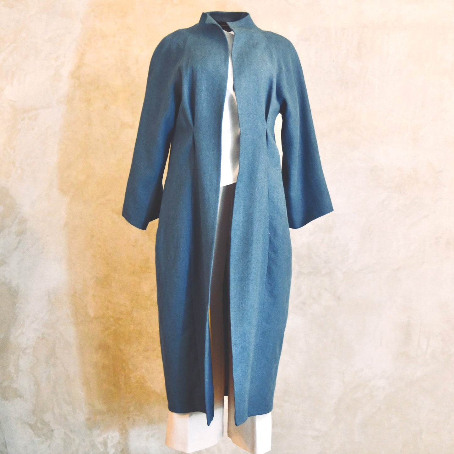 Longer Length Cocoon Coat in Blue Irish Linen. An easy to wear Spring-summer coat in a delightfully flattering cocoon shape. An investment piece to last across the years. Handmade in Britain. Front Open View.