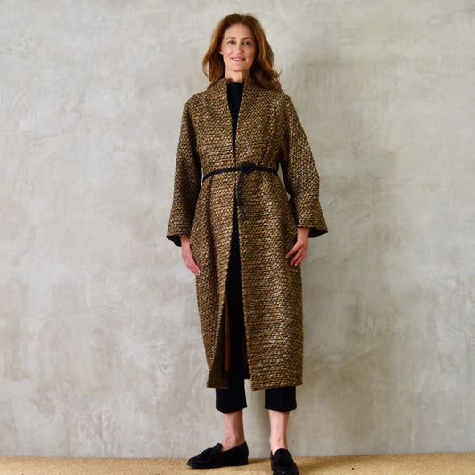 Longer Length Cocoon Coat in Golden Linton Tweeds Boucle. A dramatic, but incredibly wearable cocoon coat in a truly splendid boucle that will carry you well through Autumn and Spring. Handmade in Britain. Front Belted View