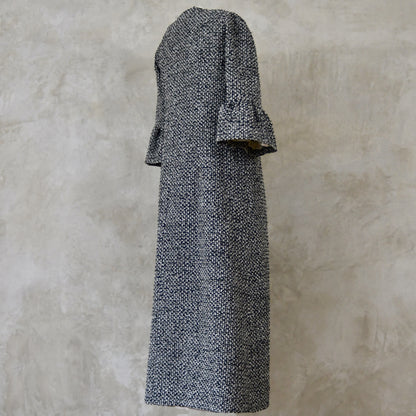 A Longer length Bell Sleeve A-Line Coat in Black and OffWhite Linton Tweeds Boucle
This is an elegant longer length A-Line coat in a patterned boucle from Carlisle. With a magnificent drape and delicate sleeve and shoulder detailing, this coat will take you everywhere. Handmade in Britain.
