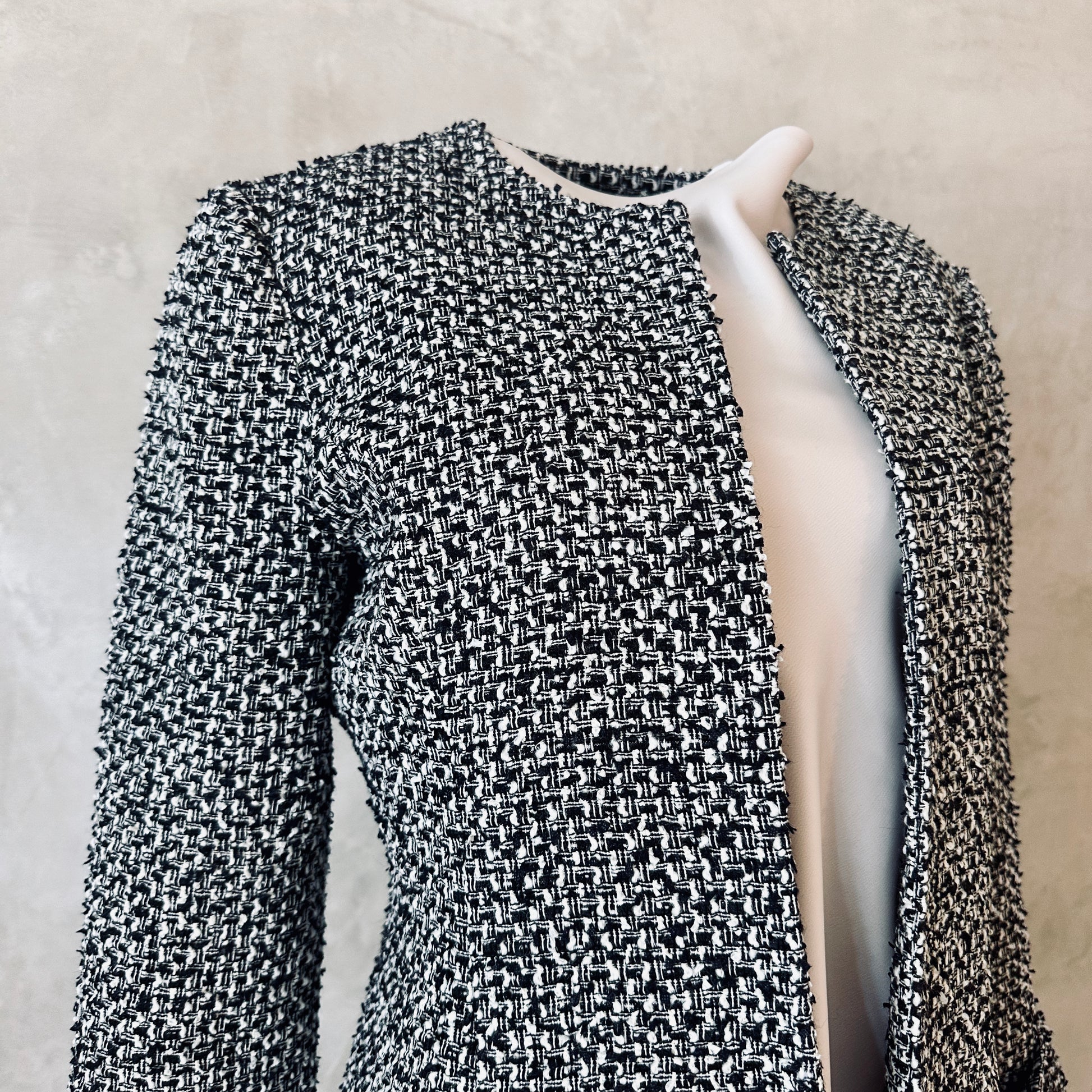 Fitted Longline Hourglass Coat in Linton Tweeds Black and White Boucle. An investment piece for Ascot, Weddings and Work. Handmade in Britain. Collar Detail.