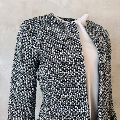 Fitted Longline Hourglass Coat in Linton Tweeds Black and White Boucle. An investment piece for Ascot, Weddings and Work. Handmade in Britain. Collar Detail.