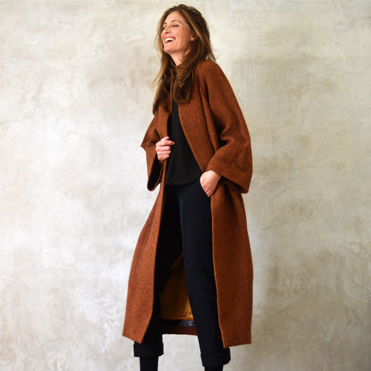 Longer Length Russet Tweed Cocoon Coat. A superbly warm and elegant coat - perfect for dressing up and wrapping up in winter. Pure Wool Coat. Handmade in Britain. Laughing Model